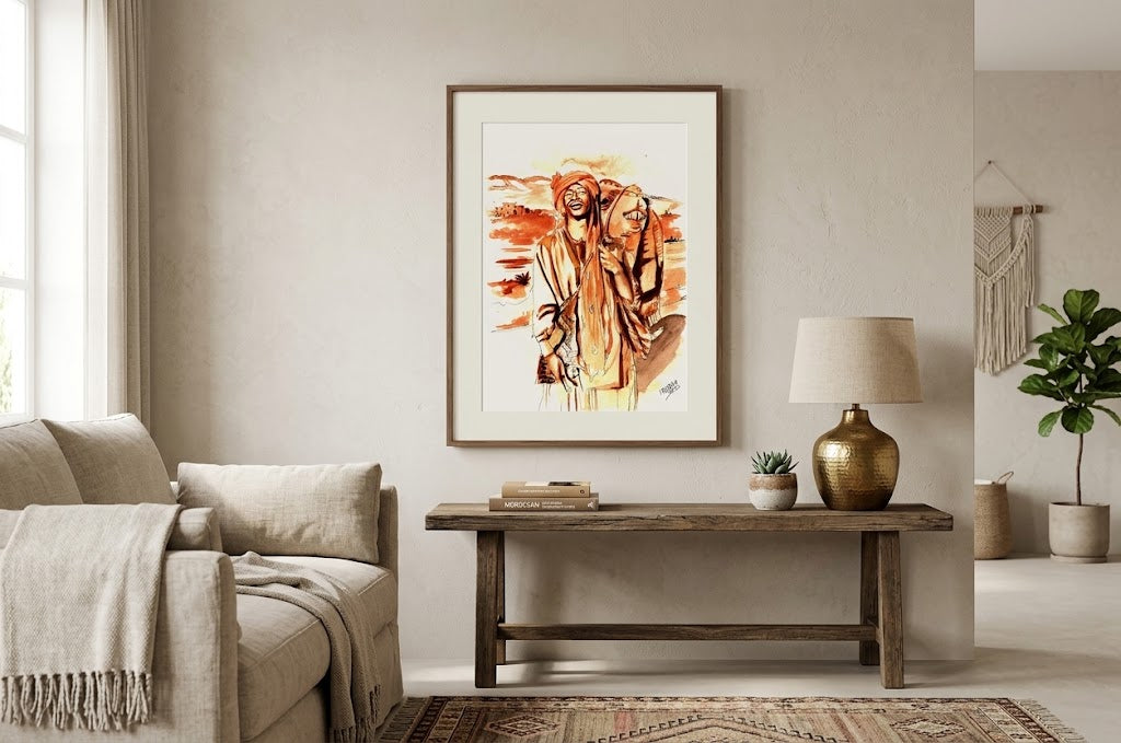 Tableau encadré représentant l'aquarelle Le Sourire du Nomade, accroché au-dessus d'une console en bois dans un salon lumineux.