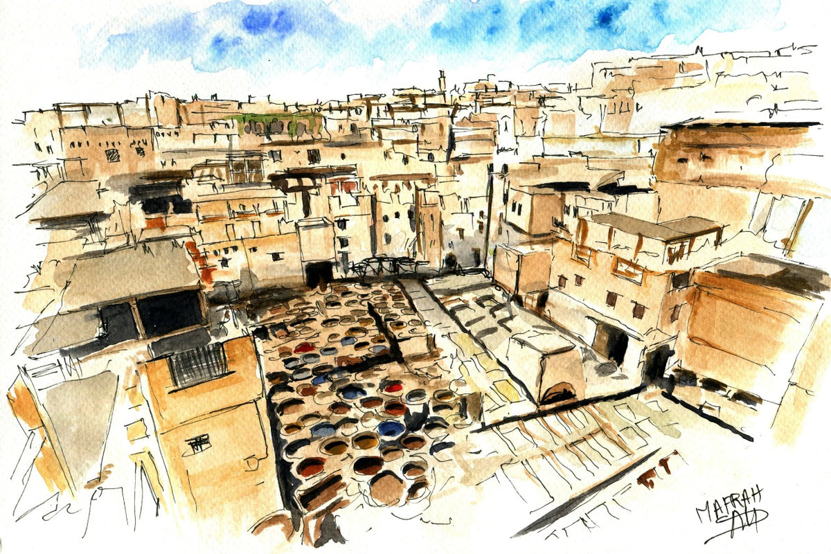 Tableau encadré de l'aquarelle « Les Cuves de Fès », accroché au mur au-dessus d'un meuble en bois bas dans un salon moderne aux teintes neutres.