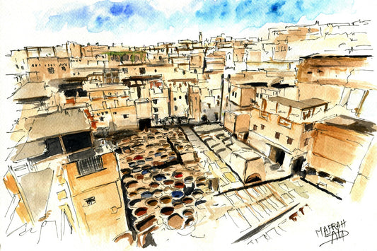 Tableau encadré de l'aquarelle « Les Cuves de Fès », accroché au mur au-dessus d'un meuble en bois bas dans un salon moderne aux teintes neutres.