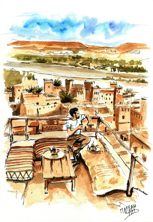 Aquarelle d'un homme buvant du thé sur une terrasse en pisé face au panorama d'une kasbah marocaine.
